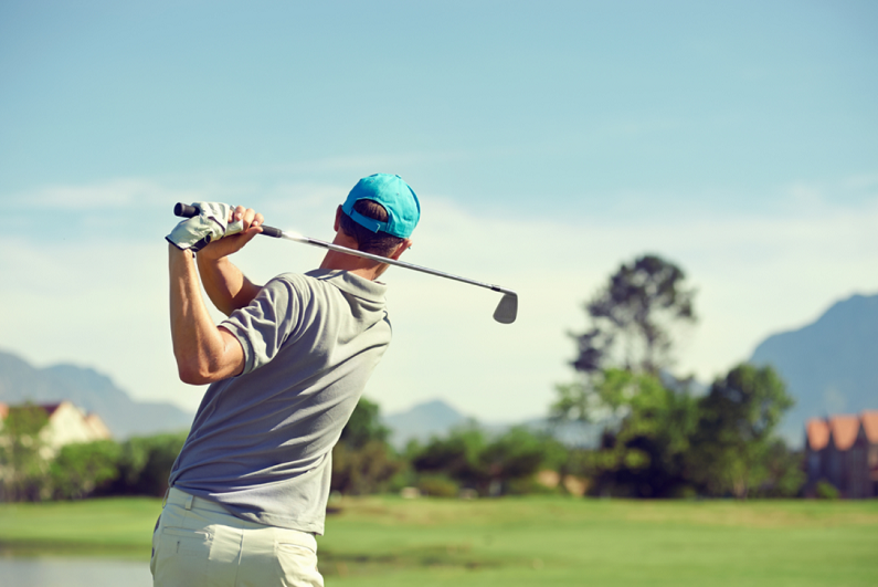 golfer hitting shot with a club