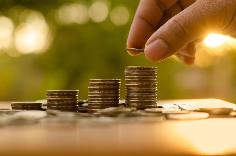 hand piling stacks of coins