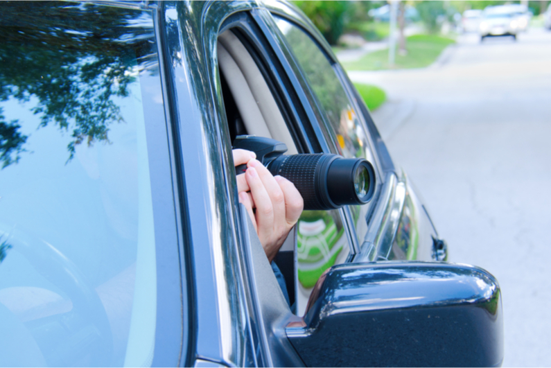 Person taking photos from their car