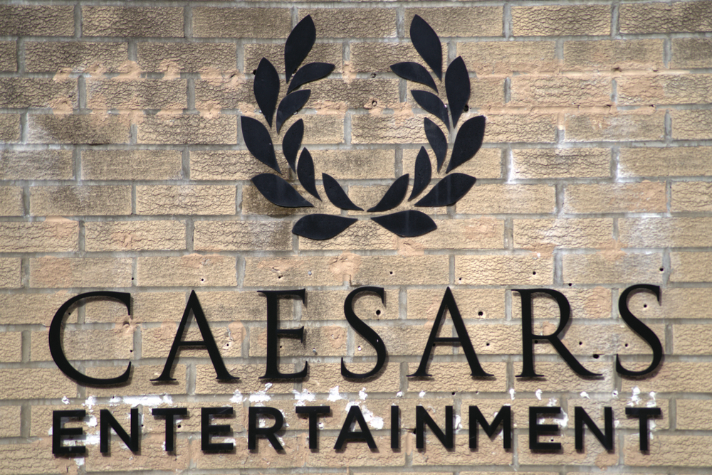 logo of Caesars Entertainment on brick wall